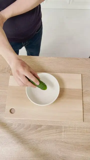 Cut a cucumber in half with a swipe of your finger - 0